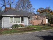 Image of the house begong demoloished to make way for new future development of the site. 