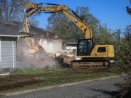 Image of the house begong demoloished to make way for new future development of the site. 