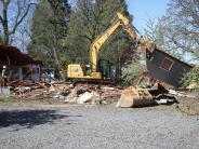 Image of the house begong demoloished to make way for new future development of the site. 