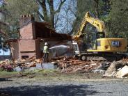 Image of the house begong demoloished to make way for new future development of the site. 
