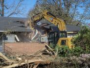 Image of the house begong demoloished to make way for new future development of the site. 
