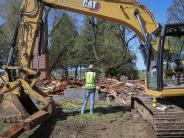 Image of the house begong demoloished to make way for new future development of the site. 